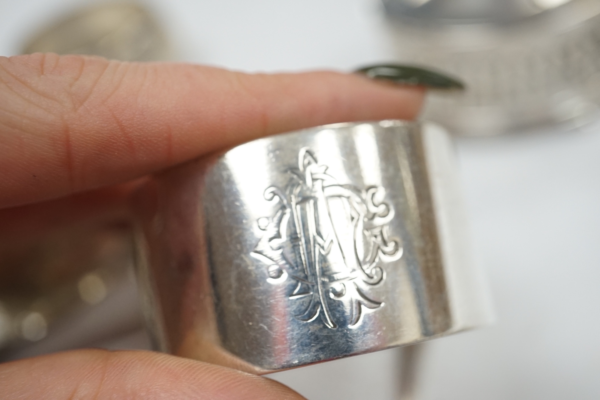 Assorted small silver ware including two vesta cases, cigarette case, matchbox sleeve, napkin rings, pair of sugar tongs and assorted condiments. some lacking liners. Condition - poor to fair